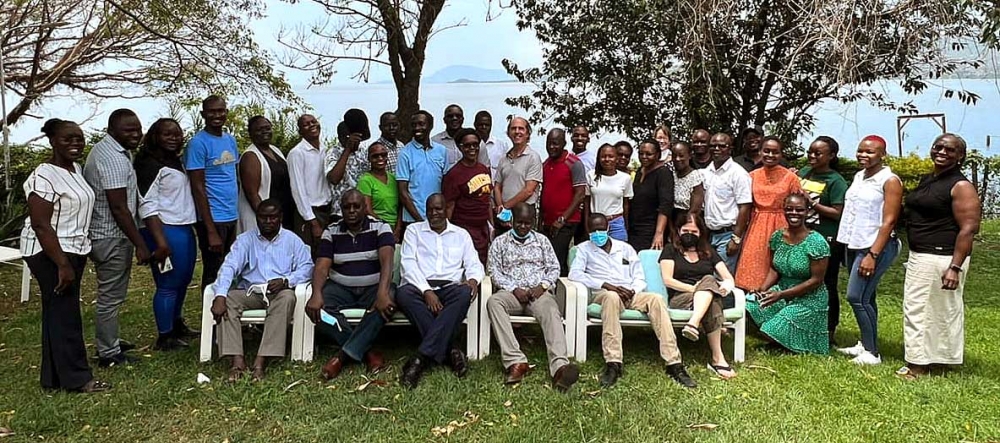 Large group of people posing for a photo outside at Kenya writing retreat